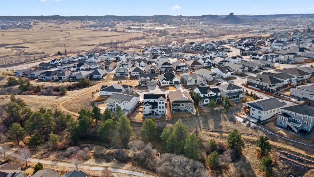 A high drone view of the back yard of a high end luxury home in Castle Rock, Colorado
