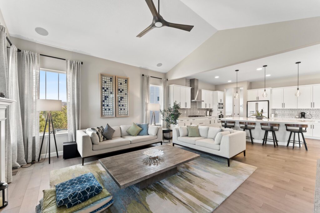 A luxury living room with views of the attached chef's kitchen.