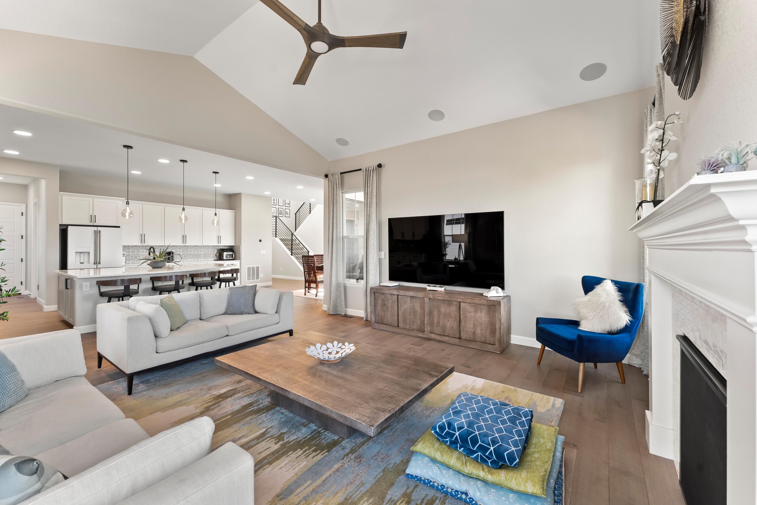 Amazing luxury living room with fireplace and attached kitchen.