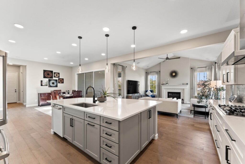 Amazing luxury kitchen and living room with fireplace and attached dining room.