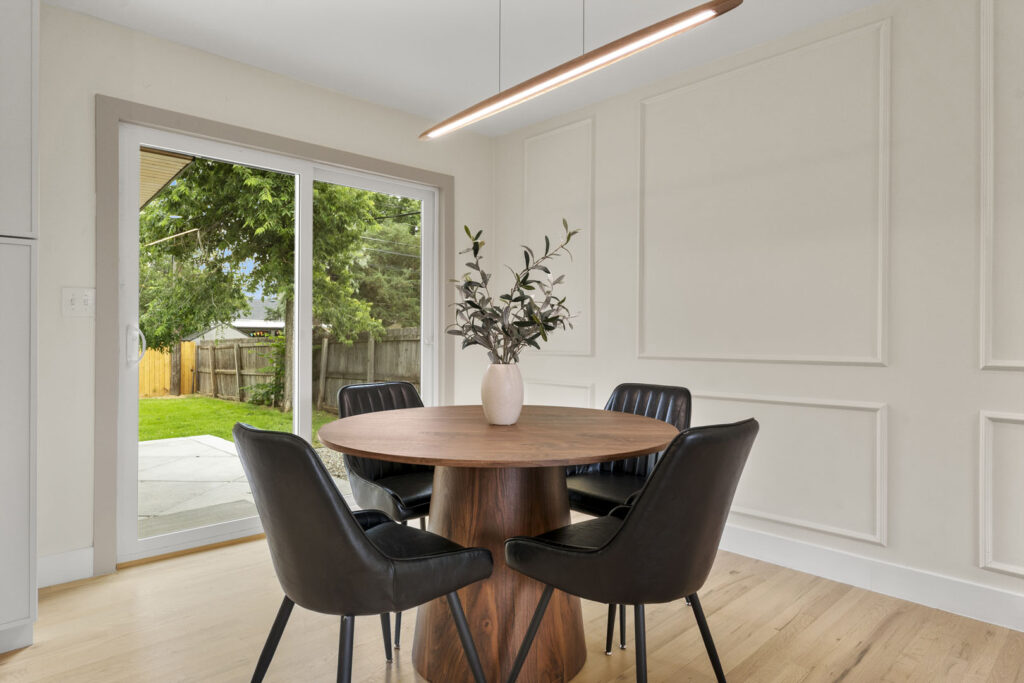 Real Estate Photograph of a Modern Dining Room with Overhead Lighting