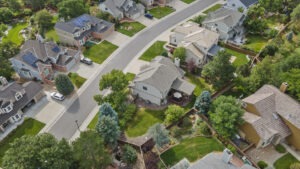 Luxury home in Highlands Ranch showing private treed lot, seen from aerial perspective