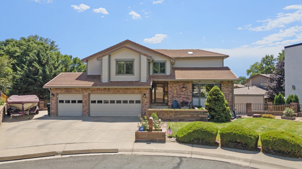 Drone photo of the front of a modern luxury home in Parker